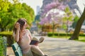 Beautiful woman in Paris, reading outdoors Royalty Free Stock Photo