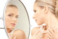Beautiful woman with pearl beads and mirror Royalty Free Stock Photo