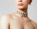 Beautiful woman with Pearl Necklace. Young beauty model with pearl pendant and earrings. Jewellery and accessories