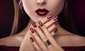 Beautiful woman with perfect make-up and manicure wearing jewellery