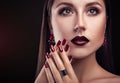 Beautiful woman with perfect make-up and manicure wearing jewellery Royalty Free Stock Photo