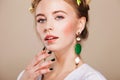 Beautiful woman with perfect makeup wearing earrings Royalty Free Stock Photo