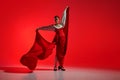 Beautiful woman, performing flamenco with grace, dynamic movements reflecting fiery heart of traditional Spanish dance.