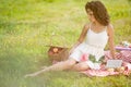 Beautiful woman on picnic on nature. Beautiful Young girl Outdoors. Enjoy Healthy Smiling Girl.