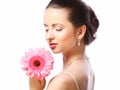 Beautiful woman with pink flower isolated on white Royalty Free Stock Photo