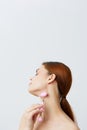 beautiful woman pink quartz roller scraper skin care massage bare shoulders isolated background
