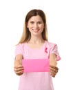 Beautiful woman with pink ribbon holding card on white background. Breast cancer concept Royalty Free Stock Photo