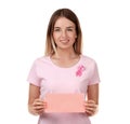 Beautiful woman with pink ribbon holding card on white background. Breast cancer concept Royalty Free Stock Photo