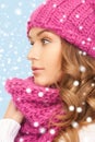 Beautiful woman in pink winter hat and muffler