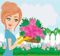 Beautiful woman plant flowers in the garden