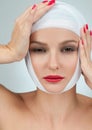 Beautiful woman after plastic surgery with bandaged face. Plastic Surgery concept Royalty Free Stock Photo