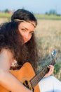 Beautiful woman playing gitar Royalty Free Stock Photo