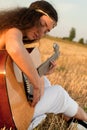 Beautiful woman playing gitar Royalty Free Stock Photo