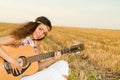 Beautiful woman playing gitar Royalty Free Stock Photo