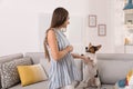 Beautiful woman playing with her cute dog Royalty Free Stock Photo