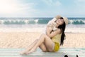 Beautiful woman playing with maltese dog