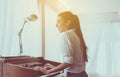 Beautiful woman playing piano,Happy and smiling,Relax time Royalty Free Stock Photo