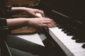 Beautiful woman playing piano, learn to play piano Royalty Free Stock Photo