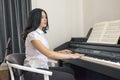 Beautiful woman playing piano Royalty Free Stock Photo