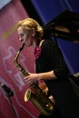 Beautiful woman plays the saxophone