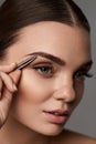 Beautiful Woman Plucking Eyebrows. Beauty Brows Correction Royalty Free Stock Photo