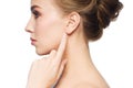 Beautiful woman pointing finger to her ear Royalty Free Stock Photo