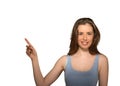 Beautiful woman pointing with finger up to side at empty copy space Royalty Free Stock Photo