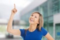 Beautiful woman pointing somewhere Royalty Free Stock Photo