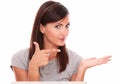 Beautiful woman pointing to her left palm up Royalty Free Stock Photo