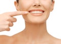 Beautiful woman pointing to teeth Royalty Free Stock Photo