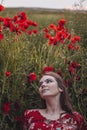 Beautiful woman in poppies field beauty portrait photoshoot