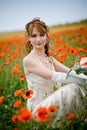 Beautiful woman in poppy field Royalty Free Stock Photo