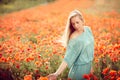 Beautiful woman on poppy flower field Royalty Free Stock Photo