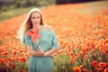 Beautiful woman on poppy flower field Royalty Free Stock Photo