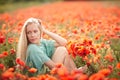 Beautiful woman on poppy flower field Royalty Free Stock Photo