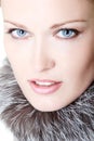 Beautiful woman portrait in furs, mid adult female face and shou