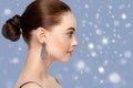 Beautiful woman portrait over blue snow winter background Royalty Free Stock Photo