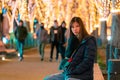 Beautiful Woman in winter clothing at night in The Jozenji christmas light up festival in Sendai, Japan Royalty Free Stock Photo