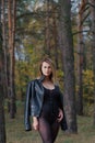 Beautiful woman posing in autumn forest. Beautiful pictures of women.