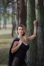 Beautiful woman posing in autumn forest. Beautiful pictures of women.