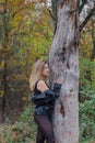 Beautiful woman posing in autumn forest. Beautiful pictures of women.