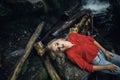 Beautiful woman posing near waterfall