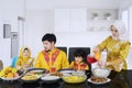 Beautiful woman pouring syrup for her family