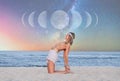 Beautiful woman is practicing yoga on the beach on Milky Way background