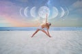 Beautiful woman is practicing yoga on the beach on Milky Way background