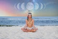 Beautiful woman is practicing yoga on the beach on Milky Way background