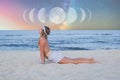 Beautiful woman is practicing yoga on the beach on Milky Way background