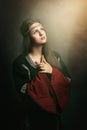 Beautiful woman praying in soft holy light Royalty Free Stock Photo