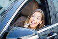 Beautiful woman putting on lipstick in car Royalty Free Stock Photo