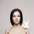 Beautiful woman with rabbit